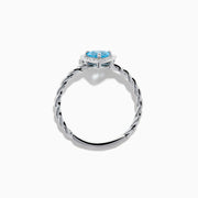 The 925 Sterling Silver Blue Topaz and Diamond Ring features a twisted band, a heart-shaped blue topaz center, and sparkling diamonds, shown against a plain white background.