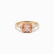 A beautiful 14K Rose Gold Cushion Solitaire Morganite and Diamond Ring featuring a large peach cushion-cut morganite center stone, accented by three round white diamonds on each side.