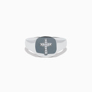 The 925 Sterling Silver Diamond Cross Ring features a flat, oval top with a raised diamond cross set with small white stones against a black background, creating a simple and elegant design.