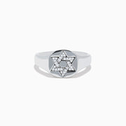 The 925 Sterling Silver Diamond Star of David Ring features a raised, diamond-encrusted Star of David on a polished band, elegantly displayed against a white background.