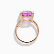 The 14K Rose Gold Kunzite and Diamond Ring features a striking cushion-cut kunzite gemstone at the center, accented with sparkling diamonds along the band.