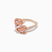 The Blush 14K Rose Gold Morganite and Diamond Bypass Ring showcases two large pear-shaped peach morganites and a diamond-accented band, set in rose gold against a white background.