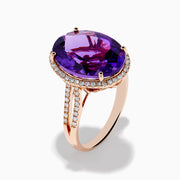 The 14K Rose Gold Amethyst and Diamond Ring showcases an oval amethyst with a diamond halo set on a rose gold band, displayed against a plain white background.