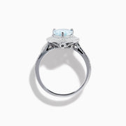 The Aquarius 14K White Gold Aquamarine and Diamond Cocktail Ring showcases a pear-shaped aquamarine with a double halo of round diamonds on a white gold band, beautifully displayed against a white background.