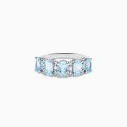 The Aquarius 14K White Gold Aquamarine and Diamond Ring features seven oval aquamarine gemstones set in a row on a plain white background.