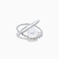The 14K White Gold Fresh Water Pearl and Diamond Criss Cross Ring features a large freshwater pearl at the center and an intersecting band set with sparkling diamonds, shown on a white background.