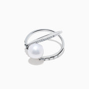 The 14K White Gold Fresh Water Pearl and Diamond Criss Cross Ring features a large freshwater pearl at the center and an intersecting band set with sparkling diamonds, shown on a white background.