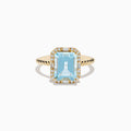 The 14K Yellow Gold Aquamarine and Diamond Ring showcases a large rectangular aquamarine, accented by round and baguette diamonds on a twisted yellow gold band.