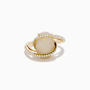 The Aurora 14K Yellow Gold Opal and Diamond Ring showcases a large oval opal center, framed by curved diamond bands, set against a white background.