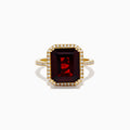 The 14K Yellow Gold Garnet and Diamond Halo Cocktail Ring showcases a large rectangular deep red garnet, surrounded by a diamond halo and diamonds on the band, set against a white background.