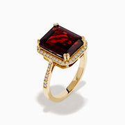 The 14K Yellow Gold Garnet and Diamond Halo Cocktail Ring showcases a large rectangular deep red garnet, surrounded by a diamond halo and diamonds on the band, set against a white background.