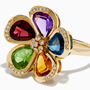 The Mosaic 14K Yellow Gold Multi Gemstone Floral Ring features five vibrant flower petals—purple, blue, yellow, green, and red—each accented with sparkling diamonds along the edges and at the center.