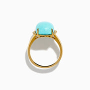 The 14K Yellow Gold Cabochon Turquoise and Diamond Ring showcases a large rectangular turquoise cabochon accented by two rows of sparkling white diamonds on each side, all set in polished yellow gold.