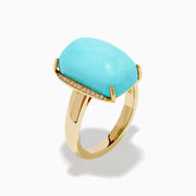 The 14K Yellow Gold Cabochon Turquoise and Diamond Ring showcases a large rectangular turquoise cabochon accented by two rows of sparkling white diamonds on each side, all set in polished yellow gold.