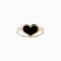 The Eclipse 14K Yellow Gold Onyx and Diamond Heart Ring features a heart-shaped black onyx centerpiece outlined with diamonds, displayed on a plain white background.