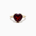 The Bordeaux 14K Yellow Gold Garnet and Diamond Heart Ring features a large heart-shaped deep red garnet at the center with small diamonds on the band, shown against a white background.