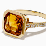 The Sunset 14K Yellow Gold Citrine and Diamond Ring showcases a large square-cut citrine center and small diamonds along the band, displayed on a plain white background.