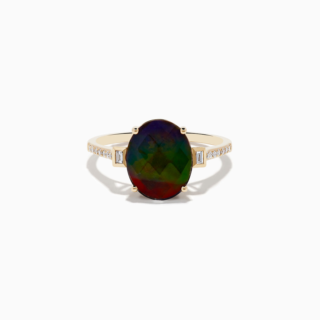 The 14K Yellow Gold Ammolite and Diamond Ring features a large oval faceted ammolite with dark green and red hues, flanked by two small rectangular stones and a band adorned with small sparkling diamonds.