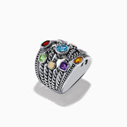 The Mosaic 925 Sterling Silver & 18K Yellow Gold Multi Color Gemstone Ring features twisted rope-style bands and seven bezel-set gemstones—blue, red, orange, yellow, purple, and green—encircling the wide ring.