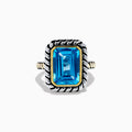 The 925 Sterling Silver and 18K Yellow Gold Blue Topaz Ring features an emerald-cut rectangular blue topaz in a twisted bezel setting with a rope-textured band, shown on a white background.