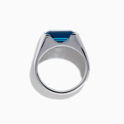 The Mens Ocean Bleu 925 Sterling Silver London Blue Topaz Ring features a large, emerald-cut rectangular gemstone set in the center, showcased against a plain white background.