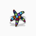 The 925 Sterling Silver Multi Color Gemstone Starfish Ring features a bold starfish design set with blue, green, purple, red, and orange gemstones against a white background.