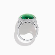 The 925 Sterling Silver Malachite Oval Ring showcases a large, oval green malachite stone with natural banding, set in four prongs and finished with decorative bead accents for a striking look.