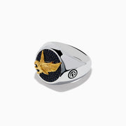 The Mens 925 Sterling Silver and Yellow Gold Eagle Ring features a round black stone face with small black gems, a raised yellow gold eagle at the center, and engraved circular symbols on each side of the band.