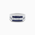The Mens 925 Sterling Silver Blue and White Sapphire Ring showcases two rows of square-cut blue sapphires and a central row of round white sapphires in a geometric design, all set against a plain white background.