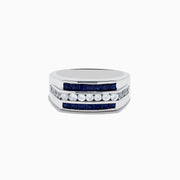 The Mens 925 Sterling Silver Blue and White Sapphire Ring showcases two rows of square-cut blue sapphires and a central row of round white sapphires in a geometric design, all set against a plain white background.