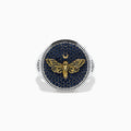 The Men's Sterling Silver Black Spinel Moth Ring showcases a gold moth and crescent moon on a round navy face, accented with sparkling black spinel stones.