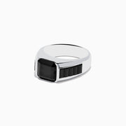 The Mens 925 Sterling Silver Black Spinel Ring showcases a large square-cut black spinel at its center, accented with smaller rectangular stones on each side of the band. Displayed on a white background, its a sophisticated choice for men.