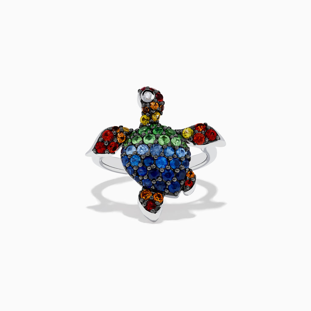 The 925 Seaside Sterling Silver Multi Sapphires Turtle Ring features a turtle design with blue, green, red, yellow, orange, and black sapphires on its shell, head, and flippers for a vibrant look.