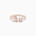 The Aurora 14K Rose Gold Opal and Morganite Toi Et Moi Ring features an asymmetrical design with a pear-shaped pink morganite and a round white opal set side by side against a plain white background.