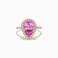 The 14K Rose Gold Kunzite and Diamond Ring features a pear-shaped pink kunzite center stone, surrounded by a halo of small white diamonds, set in a rose gold band and photographed on a plain white background.