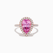 The 14K Rose Gold Kunzite and Diamond Ring features a pear-shaped pink kunzite center stone, surrounded by a halo of small white diamonds, set in a rose gold band and photographed on a plain white background.