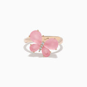 The 14K Rose Gold Rose Quartz and Diamond Butterfly Ring showcases a pink butterfly with gemstone accents and hints of rose quartz, set against a white background.