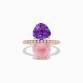The 14K Rose Gold Amethyst, Rose Quartz, and Diamond Toi Et Moi Ring features a band of small white diamonds with a large pear-shaped amethyst set above a pear-shaped rose quartz, both arranged vertically.