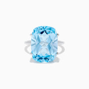 The Ocean Bleu 14K White Gold Sky Blue Topaz Ring features a large cushion-cut gemstone, showcased against a plain white background.