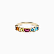 The Mosaic 14K Yellow Gold Multi Color Gemstone Bezel Ring features rectangular and oval blue, green, pink, orange, and purple gemstones evenly spaced around the band.