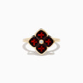 A 14K yellow gold ring featuring a red clover-shaped design in garnet with four gold-outlined petals and a small round diamond at the center.