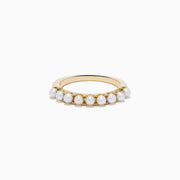 The 14K Yellow Gold Cultured Fresh Water Pearl Band features a row of small, round cultured freshwater pearls set along the top and is shown on a white background.
