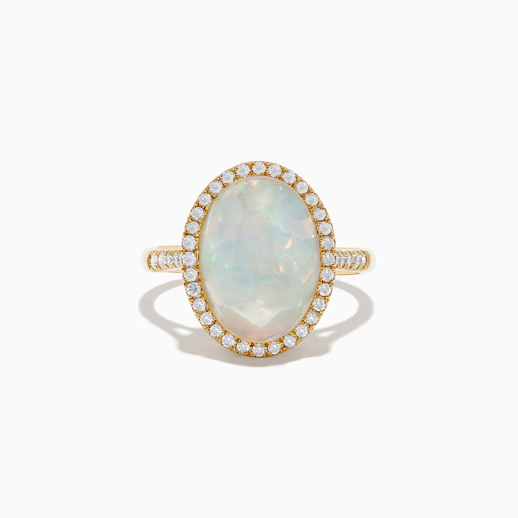 The 14K Yellow Gold Opal and Diamond Ring showcases an oval opal encircled by a halo of round diamonds, with more diamonds along the band, displayed on a white background.