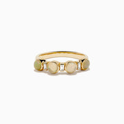 The 14K Yellow Gold Opal and Diamond Bezel Band showcases four round opals and three small rectangular diamonds set in a row, displayed on a white background.