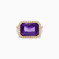 The 14K Yellow Gold Amethyst and Diamond Halo East West Cocktail Ring showcases a rectangular purple amethyst center with a diamond halo, set on yellow gold, displayed on a plain white background.