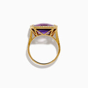 The 14K Yellow Gold Amethyst and Diamond Halo East West Cocktail Ring showcases a rectangular purple amethyst center with a diamond halo, set on yellow gold, displayed on a plain white background.