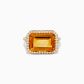 The 14K Yellow Gold Citrine and Diamond Halo East West Cocktail Ring showcases a large rectangular citrine gemstone with a diamond halo on a simple gold band, photographed against a white background.