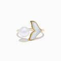 The 14K Yellow Gold Fresh Water Pearl and Mother Of Pearl Ring features a round freshwater pearl and a whale tail-shaped mother-of-pearl inlay, shown against a white background.