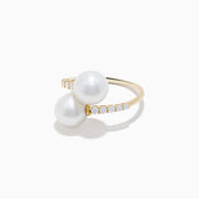 The 14K Yellow Gold Fresh Water Pearl and Diamond Bypass Ring features two large pearls at each end and a diamond-lined band for an open-ended, elegant look.
