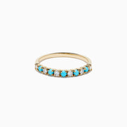 The 14K Yellow Gold Turquoise and Diamond Band features alternating small turquoise stones and white diamonds set in a row on the front half of the band, shown on a white background—a striking turquoise ring with diamond accents.